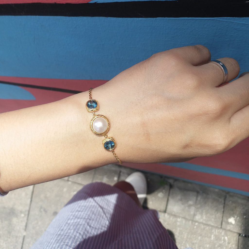 Vintage Imperial lustrous pearl with london blue topaz bracelet in gold