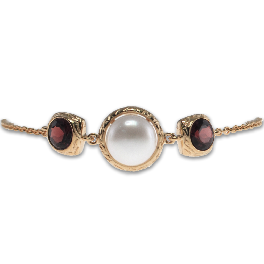 Vintage Imperial signature pearl bracelet bezel with garnet
